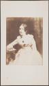 [Seated woman]