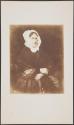 [Seated woman]