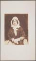 [Seated woman]