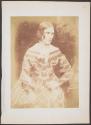[Seated woman in polka dot dress]