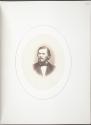 [Man with beard and parted hair]