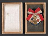 Medal, ribbon, and box to George Eastman from Japan Chamber of Commerce