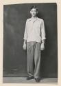 [Young man in casual shirt and slacks]