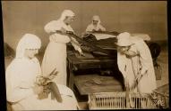 [Red Cross workers cutting paper (?), ARC War Relief]