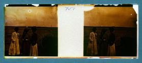 [Three women on shore by lake]