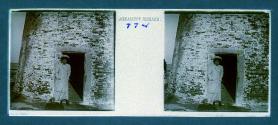 [Woman posing by door of lighthouse]