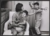 Mother breaking up fighting brothers