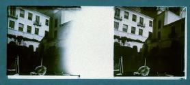 [Woman seated in courtyard]