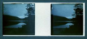 [Sunset/sunrise over mountains and water]