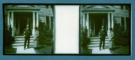 [Two people in front of house]