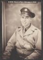 [Smiling soldier in jacket and cap]