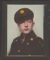 [Soldier with ribbon on lapel and chain on shoulder]