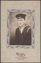 [Sailor in uniform, US Navy flat hat]