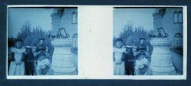 [Woman and children next to sun dial]