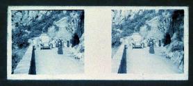 [Woman on road car and other women in backround]