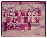 [Eighteen bottles of liquor]