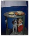 [Toasted almond cake with boy and dog]