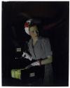 [Woman snooping in file cabinet]