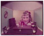 [Girl and doll house]