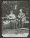 Young George Eastman posing with couple