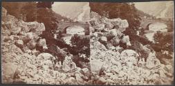 [Two people on hillside by a bridge in Cumberland Narrows]