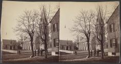 [Group standing near a church]