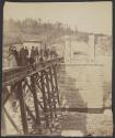 [Group gathered on bridge]