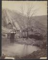[Bridge and log cabins]