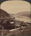 [Person on bank overlooking the Potomac River and Bollman Truss Bridge, Harpers Ferry, WV]