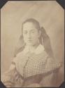 [Young woman with hair bow]