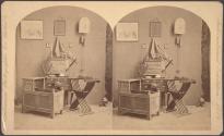 [Log cabin furniture, including Governor Endecott's chair, the Fuller Cradle, and John Alden's desk]