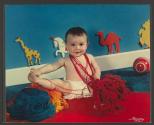 [Baby playing with yarn (Cream of Wheat)]