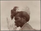 The Karamojong warrior is a remarkable sight. His hairdo is elaborately contrived with clay, cowdung, and fat....