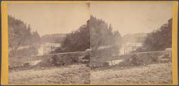 [Landscape view of river and trees from road]