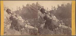 [Rocks and trees in quarry]