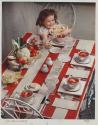 [Girl setting a table (McCall's)]