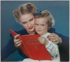 [Woman and girl reading The Night Before Christmas (McCall's)]