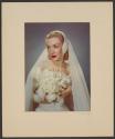 [Bride with white bouquet]