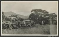 People around automobiles, African Safari