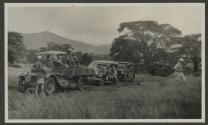 People around automobiles, African Safari