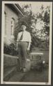 George Eastman in fez worn under tent, African Safari