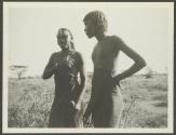 Two native inspecting Buick, African Safari