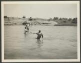 Pulling cars across ford at Archer's Post, African Safari