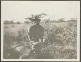 Phil Percival's gun boy, with Audley Stewart's lion, African Safari