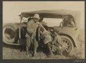 George Eastman's first lion (8'8"), gun bearer and Audley Stewart, African Safari