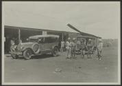 George Eastman and companions beside automobiles, African Safari