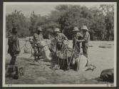 George Eastman and companions beside camel, African Safari