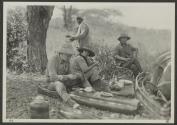 George Eastman and companions dining on ground, African Safari