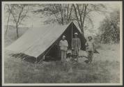 Dan Pomeroy with native guides outside tent, African Safari
