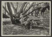 George Eastman reading beside Osa Johnson, African Safari